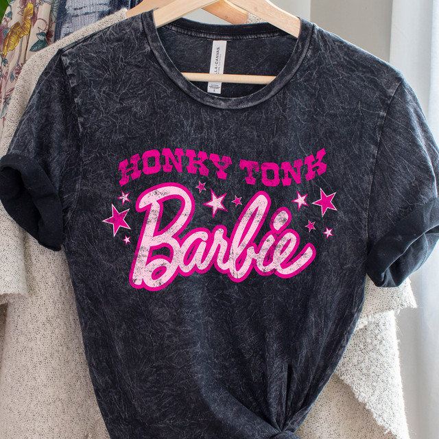 Honky Tonk Doll DTF Heat Transfer, black T-shirt with pink and white graphic text and stars design.