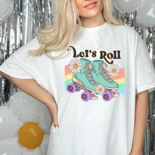 Let's Roll DTF Heat Transfer, vibrant teal roller skates with pink laces surrounded by daisies and rainbow background.