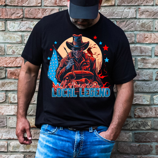 All American Legend DTF Heat Transfer, graphic on a black T-shirt featuring a spooky skeleton figure with a cowboy hat, American flag, and stars.