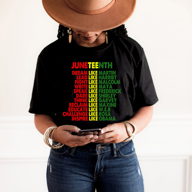 Juneteenth DTF Heat Transfer, woman wearing black t-shirt with colorful Juneteenth-themed text.
