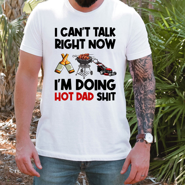 I Can't Talk Right Now I'm Doing Hot Dad Shit Mower DTF Heat Transfer, T-shirt with barbecue grill, beer bottles, and lawnmower graphic and humorous text for dads.