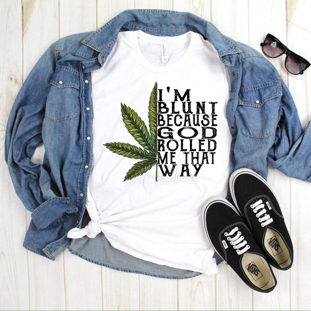 Marijuana Leaf I'm Blunt Because God Rolled Me That Way sublimation transfer, T-shirt with cannabis leaf design and humorous text.