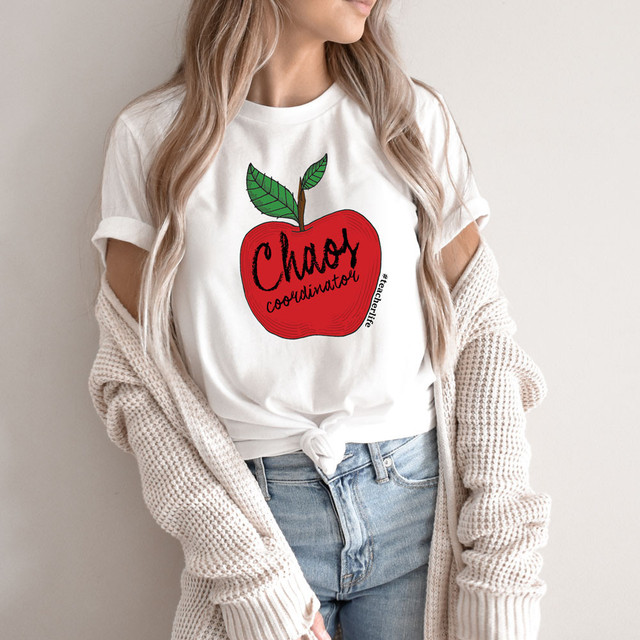 Chaos Coordinator Apple DTF Heat Transfer, a graphic design of a red apple with green leaves and the text 'Chaos Coordinator' on a white t-shirt.