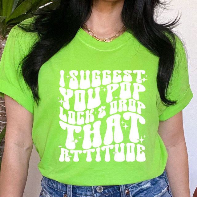 Product I Suggest You Pop Lock & Drop That Attitude WHITE DTF Heat Transfer, white heat transfer design on a bright green t-shirt.