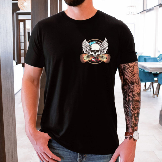 Guitar Wings Skull DTF Heat Transfer, graphic tattoo style skull with wings and guitar elements on a black t-shirt.