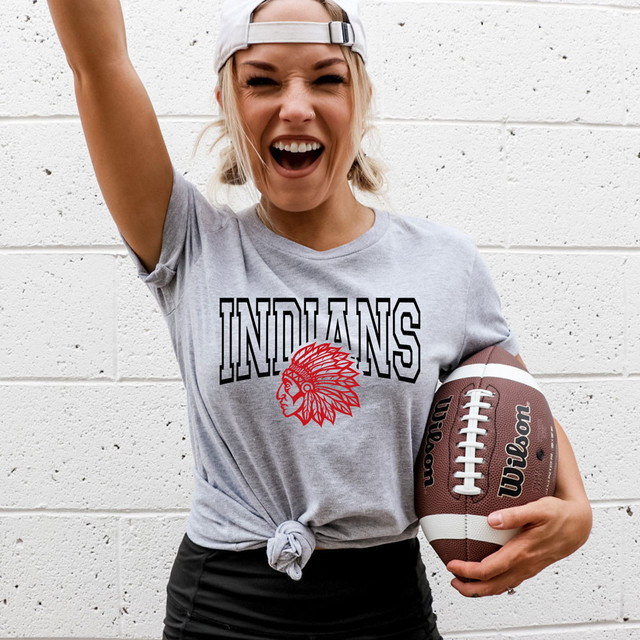 Indians *CUSTOM COLOR OPTIONS* DTF Heat Transfer, a woman wearing a gray T-shirt with a custom color Indian logo and red graphic of a Native American chief in headdress.