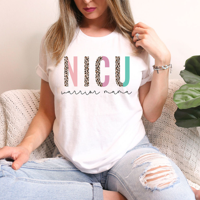 Nicu Warrior Mama DTF Heat Transfer, colorful and stylish design on a white T-shirt worn by a woman.