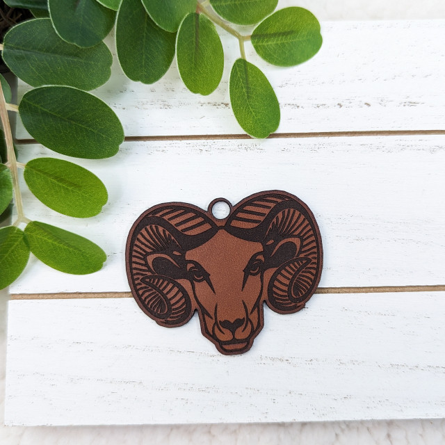 Ram Mascot Leather Keychain, brown leather keychain with a detailed ram's head design.