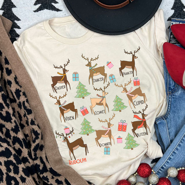 Reindeer DTF Heat Transfer, illustrated reindeers with holiday labels and gift boxes on a cream T-shirt.