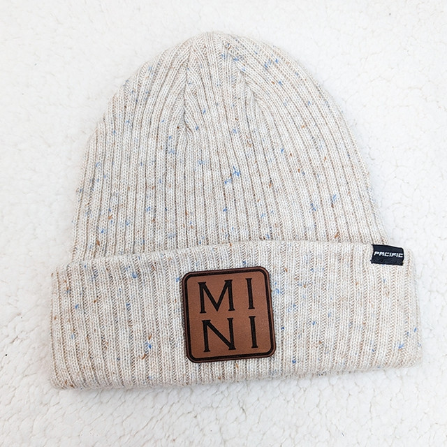 MINI Square Leather Patch, beige speckled knitted beanie hat with a brown leather patch featuring 'MINI' in black lettering.