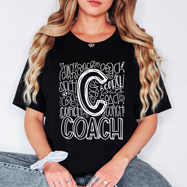 Coach Typography WHITE DTF Heat Transfer, white graphic design on black T-shirt featuring the word 'Coach' multiple times and a large central 'C' in a creative font.