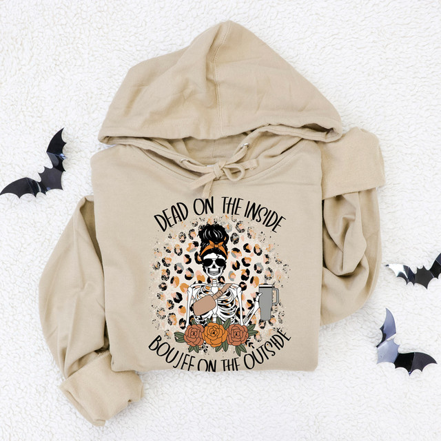 Dead On The Inside Boujee On The Outside DTF Heat Transfer hoodie with a skeleton graphic, leopard print background, roses, and the text, on a beige hoodie, surrounded by black paper bats.