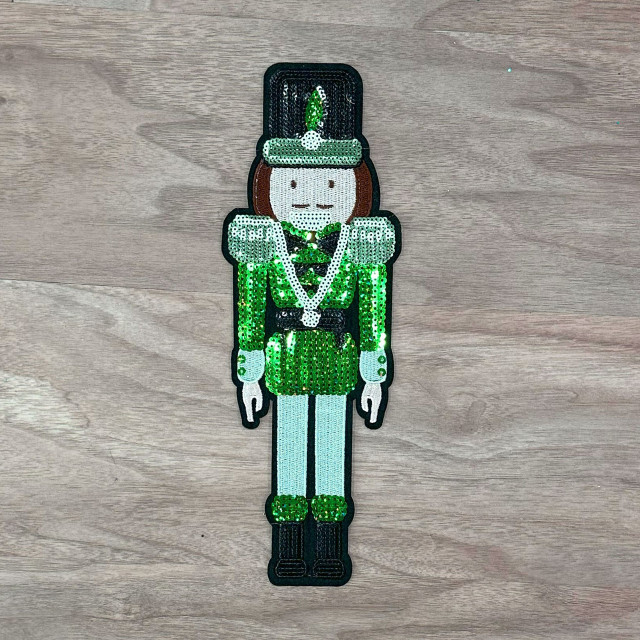 GREEN Nutcracker Sequins Embroidered Patch, a decorative patch featuring a nutcracker character in vibrant green sequins with embroidered details.