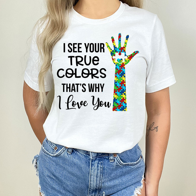 True Colors Single Hand DTF Heat Transfer, colorful puzzle piece hand design on a white T-shirt.
