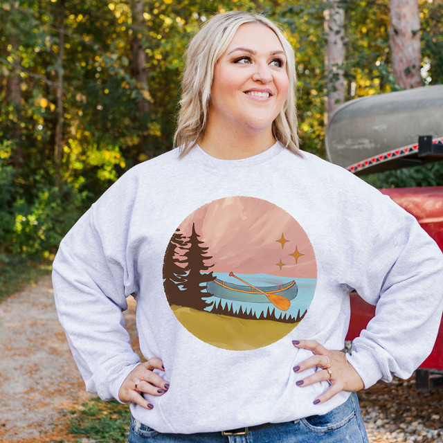 Canoe DTF Heat Transfer, landscape design featuring a canoe on water with trees and stars in the background.