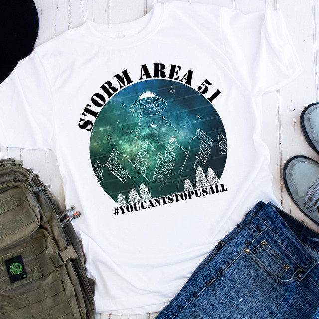 Storm Area 51 You Can't Stop Us All Blue Sublimation Transfer T-shirt with UFO, mountains, and space design.