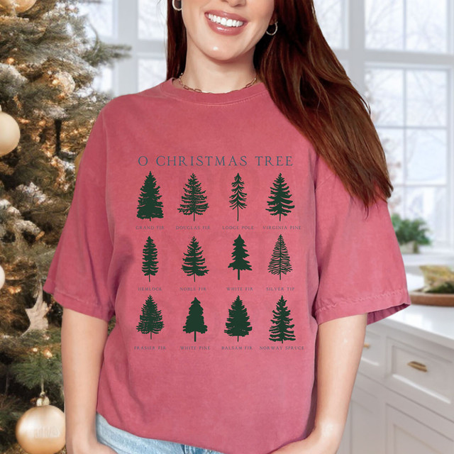 O Christmas Tree DTF Heat Transfer, image of a woman wearing a red t-shirt showcasing a design of various Christmas tree silhouettes with labeled names.