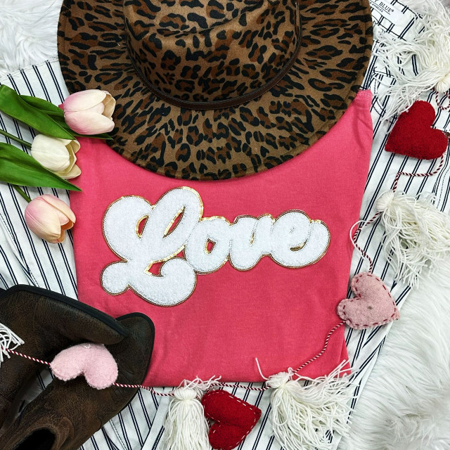 WHITE LOVE Chenille Patch, white embroidered patch with the word 'Love' on pink fabric, decorative hearts and flowers, leopard print hat, and floral elements.