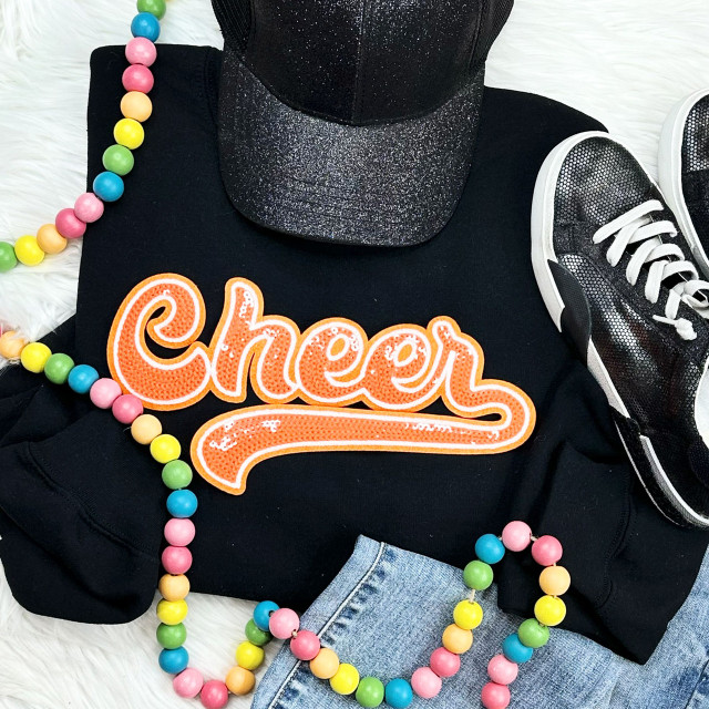 Orange Cheer Sequin Patch, an embroidered fabric patch with the word 'Cheer' in orange sequins and white outline, ideal for customizing cheerleading uniforms and apparel.