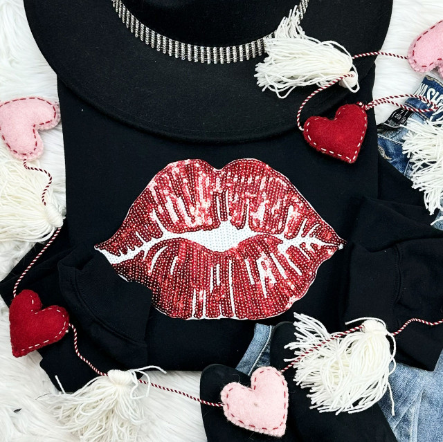 RED LIPS Sequin Patch, a close-up of a black sweatshirt featuring a large red sequin lips design.