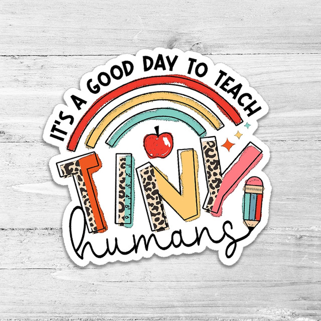 It's A Good Day To Teach Tiny Humans Die Cut Sticker, colorful educational sticker with rainbows, apple, ruler, and pencil design for teachers.