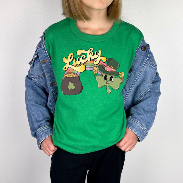 Lucky Rainbow Retro DTF Heat Transfer, colorful graphic of a leprechaun hat and a pot of gold on a green t-shirt.