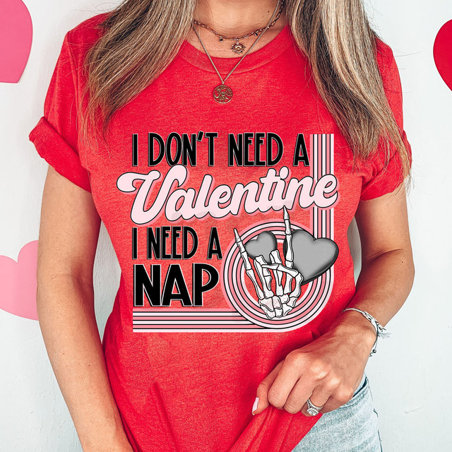 I Don't Need A Valentine, I Need A Nap DTF Heat Transfer, red T-shirt with a humorous graphic and text about preferring naps over Valentine's Day.