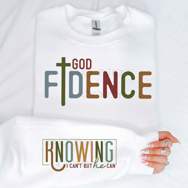 Godfidence SET DTF Heat Transfer, white sweatshirt with colorful text design of the words 'Godfidence' and 'Knowing I Can't But He Can' in various font styles and colors.