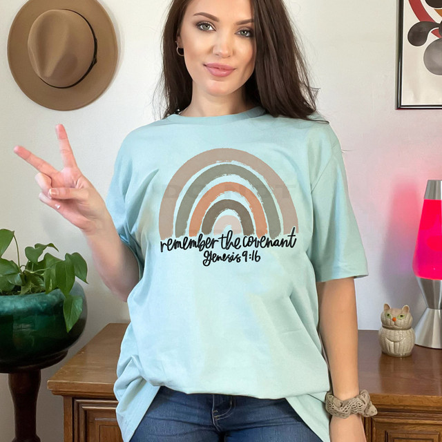 Remember The Covenant DTF Heat Transfer, a colorful rainbow design on a woman's t-shirt with the scripture Genesis 9:16.