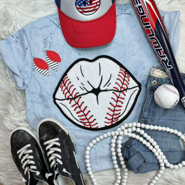 Baseball Lips Chenille Patch, embroidered white lips with red baseball stitching on a light blue denim fabric.