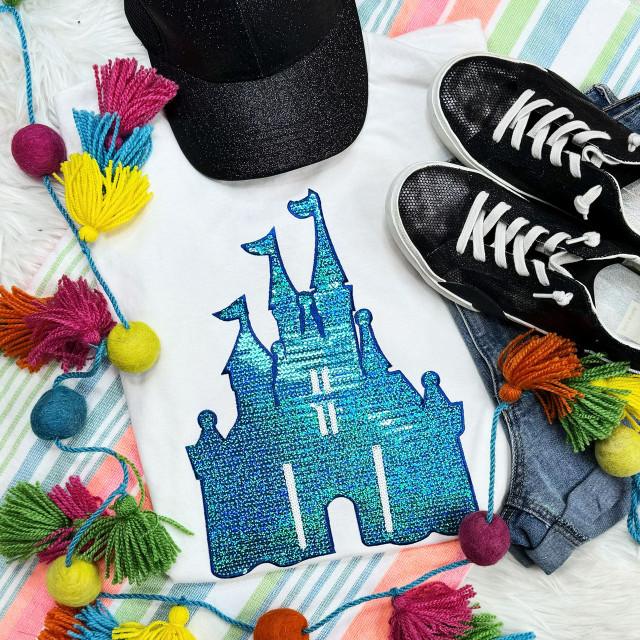 Blue Castle Sequin Patch, glittery blue castle embroidered patch on white fabric.