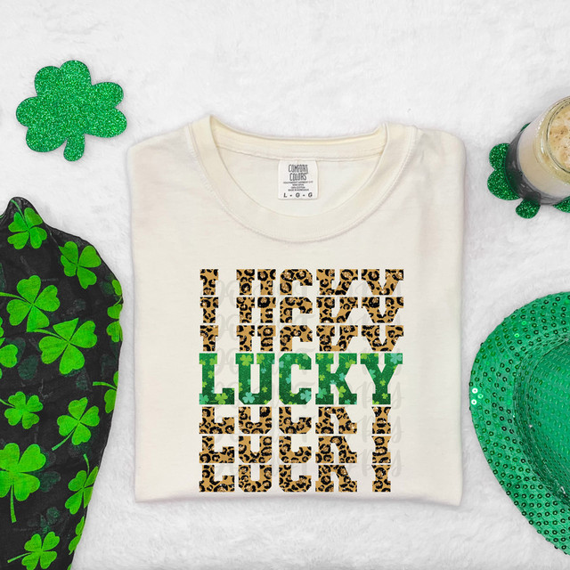 Lucky Stacked Leopard DTF Heat Transfer, a design with leopard print pattern and green text, applied on a white t-shirt.