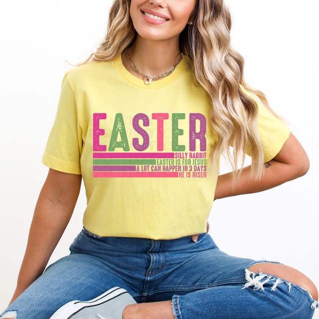 Easter Is For Jesus DTF Heat Transfer, colorful and vibrant design on a yellow t-shirt featuring Easter-themed text and graphics.
