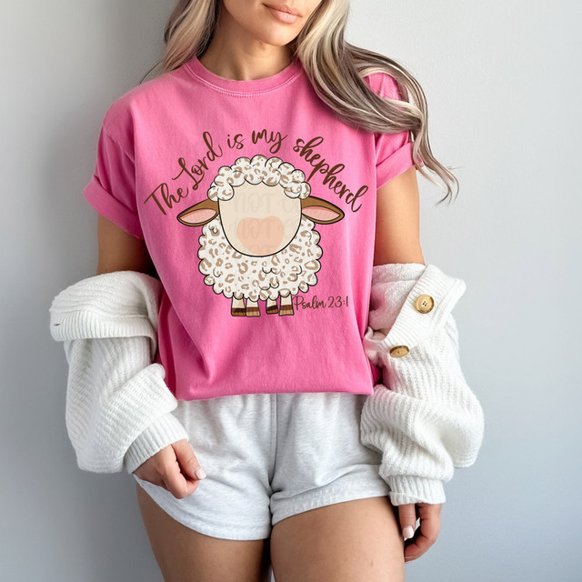 The Lord Is My Shepherd Leopard DTF Heat Transfer, pink t-shirt with a cute sheep graphic and Bible verse Psalm 23:1, designed for Christian apparel.