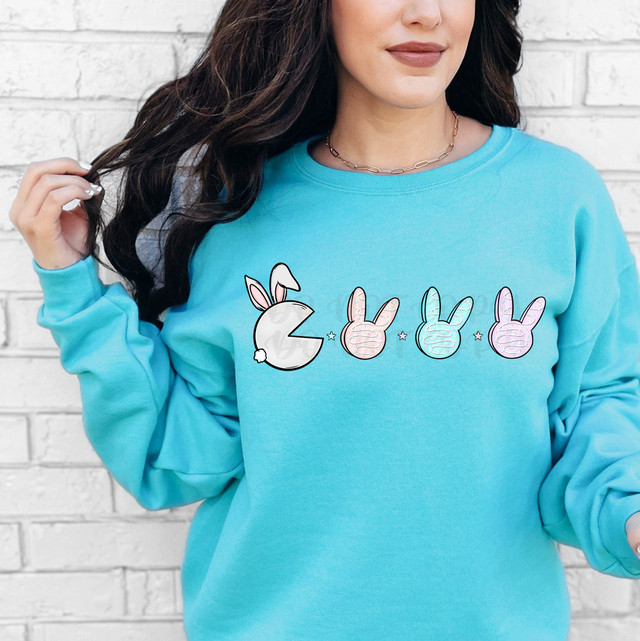 Easter Cakes Pac DTF Heat Transfer, vibrant and colorful Easter-themed design on a turquoise sweatshirt.