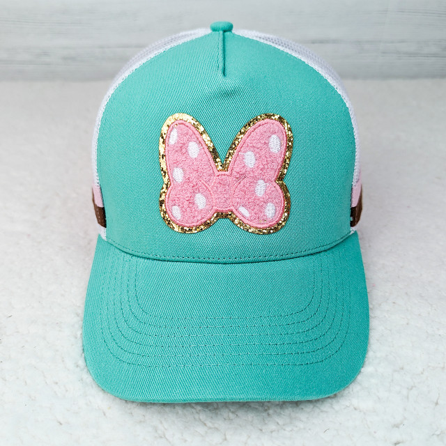 Pink Bow POLKA DOTS Glitter Chenille HAT/POCKET Patch, a turquoise cap featuring a pink embroidered bow with white polka dots, outlined with gold glitter.