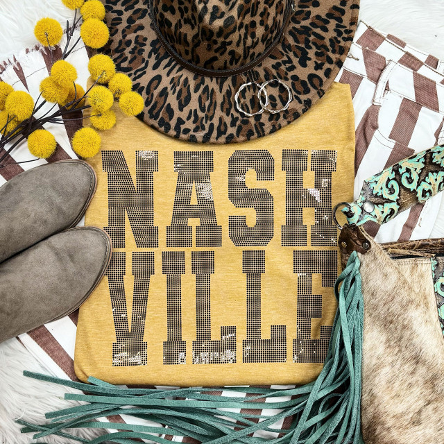 Spangled NASHVILLE Transfer, yellow T-shirt with Nashville lettering, leopard print hat, cowboy boots, yellow pom-pom flowers, denim and patterned accessories for cowgirl style.