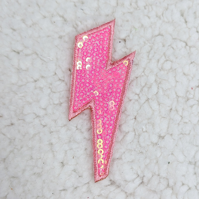 Pink Sequin Lightning Bolt HAT/POCKET Patch, decorative patch with pink sequins and embroidered border in lightning bolt shape.