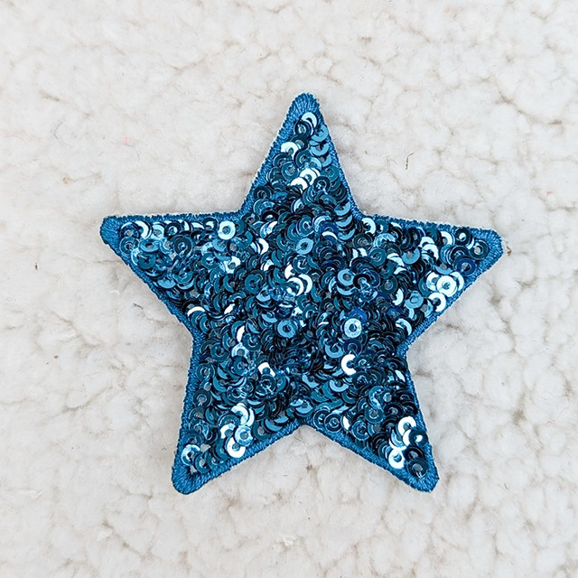 Blue sequin STAR HAT/POCKET Patch, decorative star-shaped patch covered with shiny blue sequins for embellishing clothing or accessories.