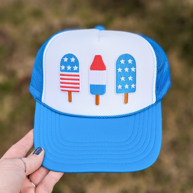 Individually Patriotic Popsicle Embroidered Hat/Pocket Patch, blue trucker hat with patriotic popsicle designs embroidered on the front panel.