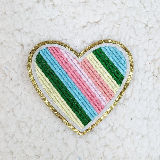 Multicolored Heart Embroidered & Glitter HAT/POCKET Patch, embroidered heart design with rainbow colors and glitter accents outlined with gold glitter.