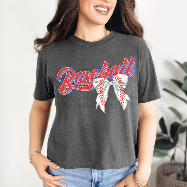 Baseball Bow DTF Heat Transfer, close-up view of a heat transfer design on a dark grey T-shirt featuring the word 'Baseball' with a decorative baseball bow in red, white, and blue colors.
