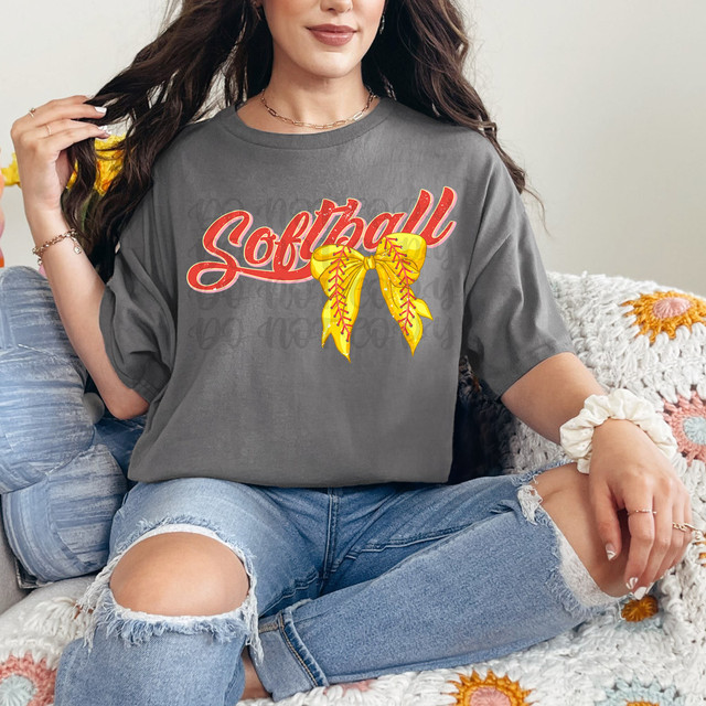 Softball Bow DTF Heat Transfer, colorful yellow softball bow design on a gray t-shirt.