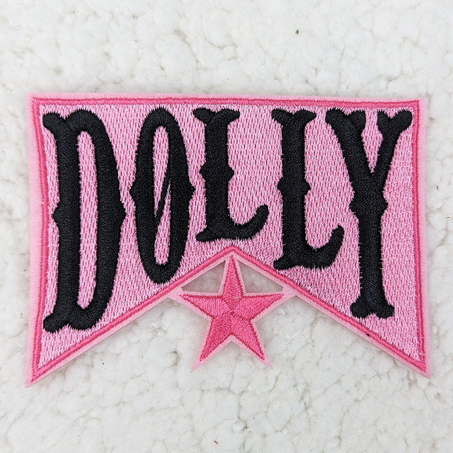 Dolly Embroidered HAT/POCKET Patch, pink fabric patch with black embroidered text and a pink embroidered star.