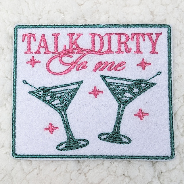Talk Dirty To Me Embroidered HAT/POCKET Patch, embroidered patch featuring the text 'Talk Dirty To Me' above two cocktail glasses with a pink and teal color scheme.