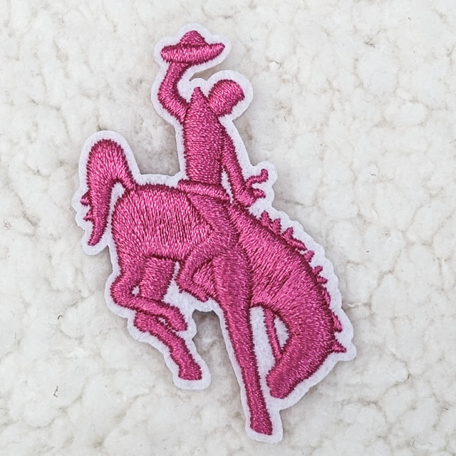 Pink Rodeo Cowboy HAT/POCKET Patch, embroidered pink cowboy riding a horse holding a hat.