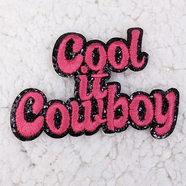 Cool It Cowboy Embroidered Glitter HAT/POCKET Patch, pink and black embroidered patch featuring the text 'Cool It Cowboy' with glitter accents.