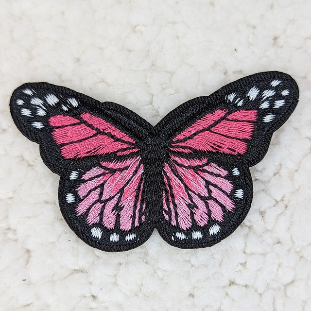 Pink Butterfly Embroidered HAT/POCKET Patch, close-up of embroidered pink butterfly patch with black and white accents on a light background.