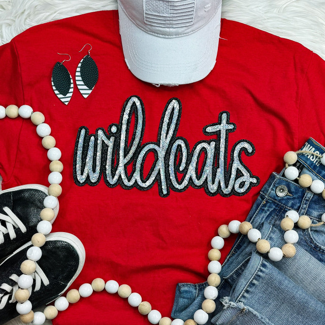 Wildcats Sequin Patch, black and white sequin appliqué patch spelling 'Wildcats' on red t-shirt.