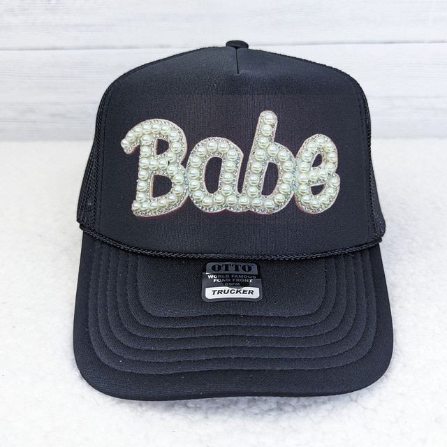 GLUE ON BABE Pearl Sparkle HAT/POCKET Patch, a black baseball cap with a pearl and rhinestone decorated "Babe" patch on the front.
